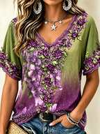 Blusa con cuello en V, encaje, pedrería y bordado floral