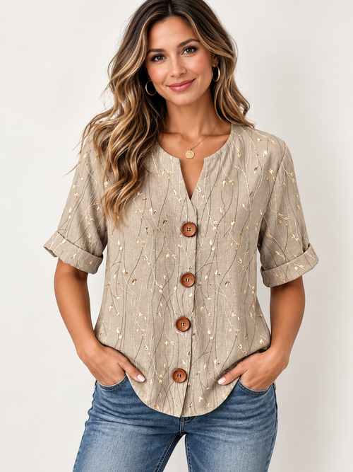 Blusa con estampado botánico, cuello dividido y botones frontales