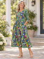 Vestido midi verde con estampado floral multicolor, cuello redondo y manga 3/4