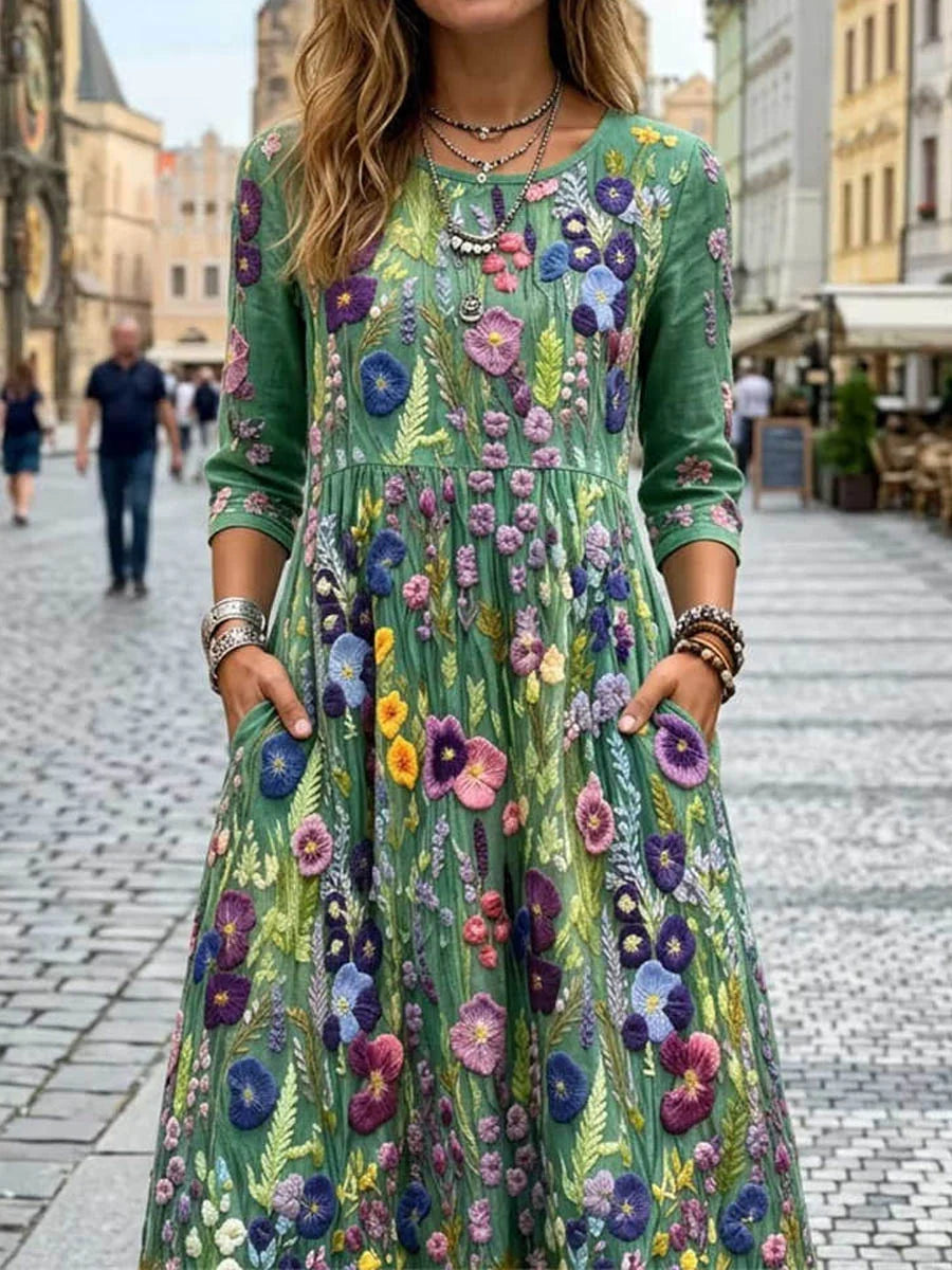 Vestido midi verde con estampado floral multicolor, cuello redondo y manga 3/4