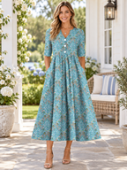 Vestido midi de media manga con cuello en V, estampado floral y pliegues, con bolsillos