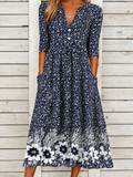 Vestido midi elegante con estampado floral, escote en V y manga al codo