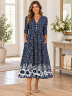 Vestido midi elegante con estampado floral, escote en V y manga al codo